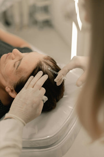 Close examination of the scalp during a consultation